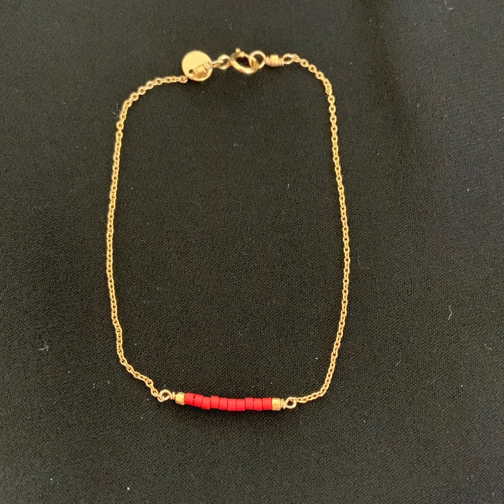 Delicate gold chain bracelet with matte red seed beads